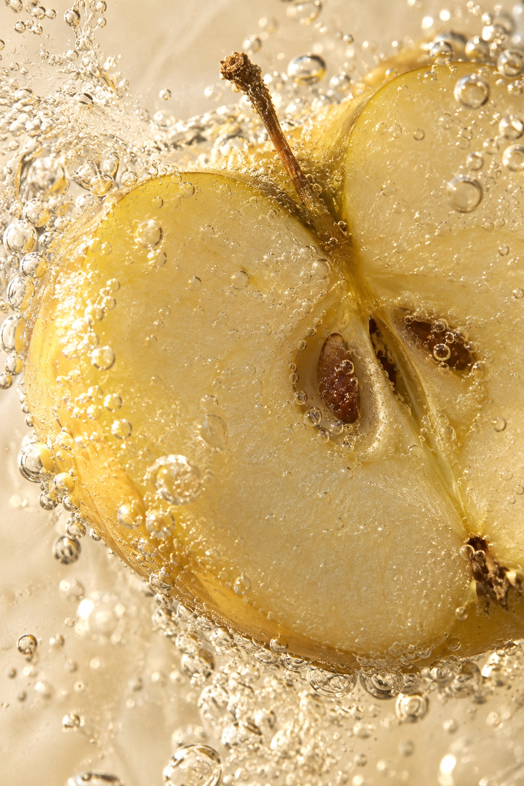 An apple surrounded by shimmering bubbles